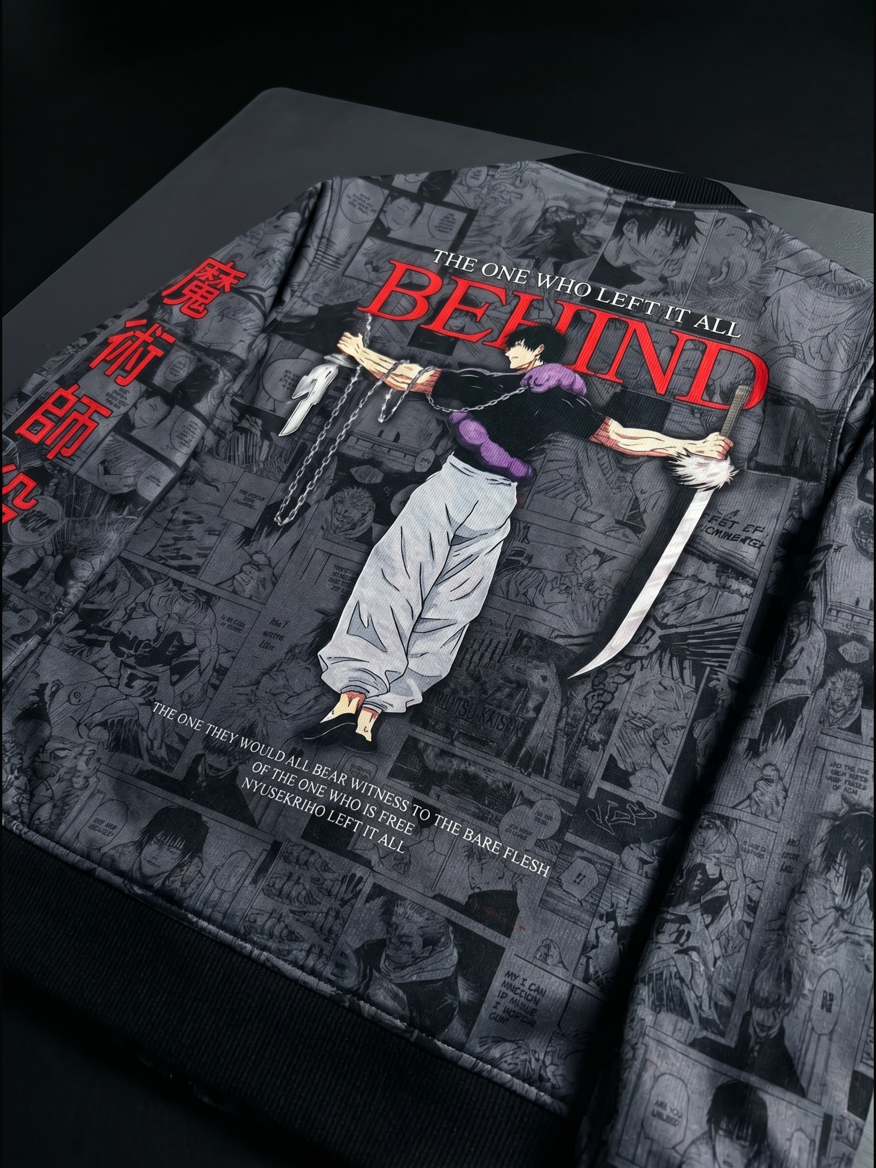 Fushiguro jacket of 'The One Who Left It All Behind' with an illustration of a person bound by chains against a dark background.